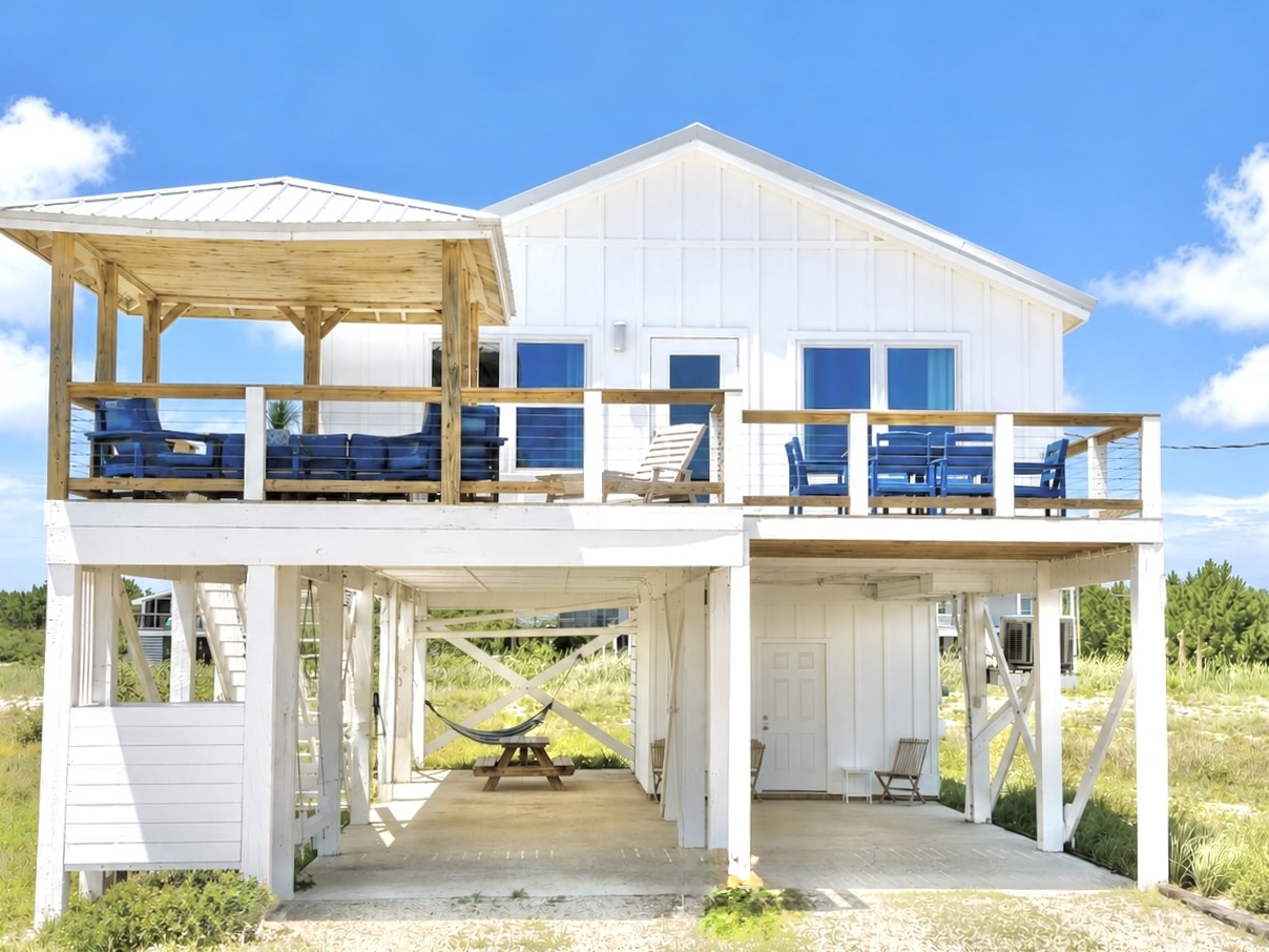 Front exterior of the elevated Good Tides Only beach cottage